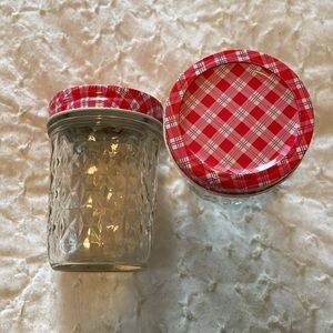 Ball quilted crystal canning jars with decorative pink plaid lids.
